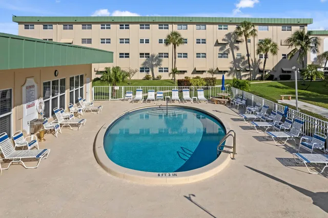 swimming pool view with a outdoor seating space