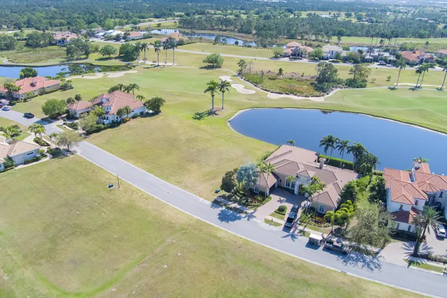 an aerial view of a house with a swimming pool yard and outdoor seating