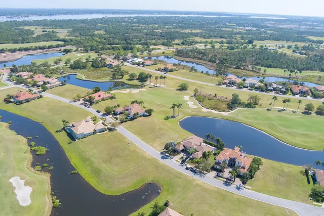 an aerial view of a residential houses with outdoor space