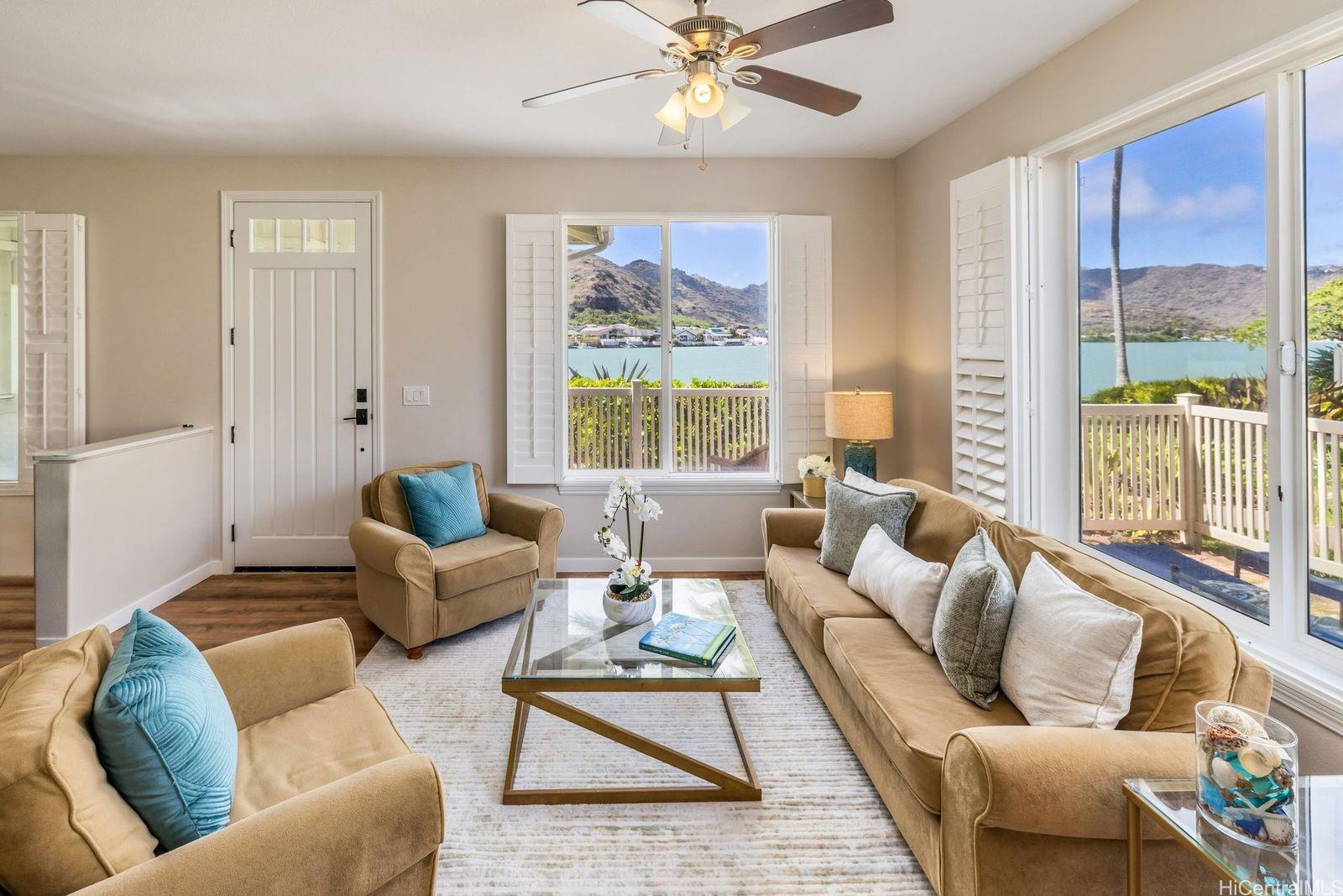 580 Lunalilo Home Road, Unit B3402 Honolulu, HI 96825 - Photo 1 of 1 a living room with furniture and a large window