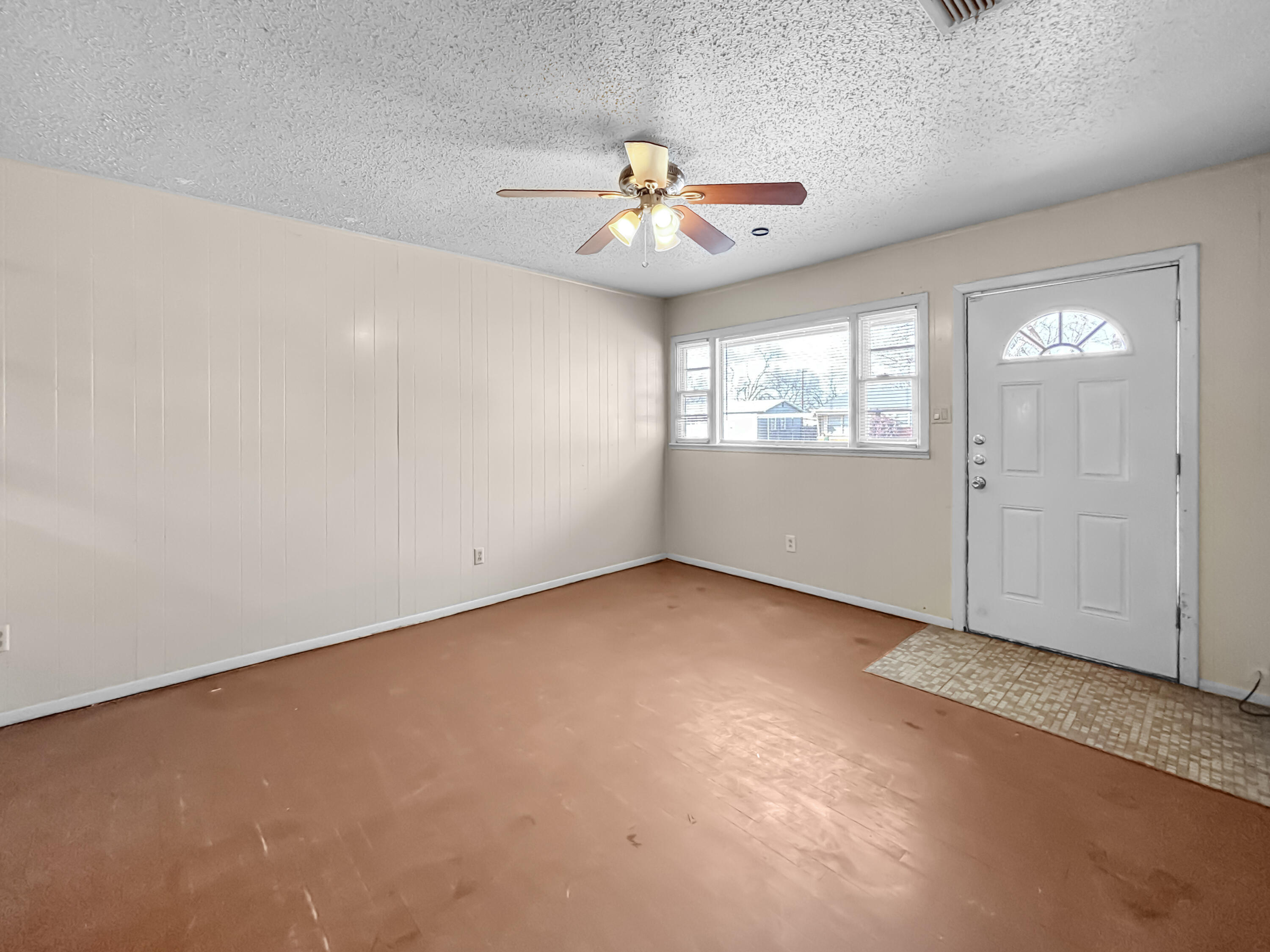 4411 45th Street Lubbock, TX 79414 - Photo 34 of 44 an empty room with windows and fan