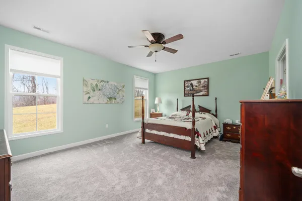 a bed room with a bed and a window