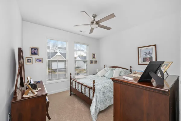 a bedroom with furniture and a window