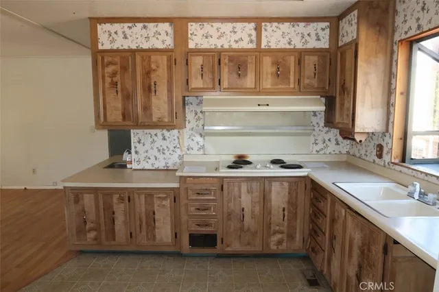 a kitchen with a sink and cabinets