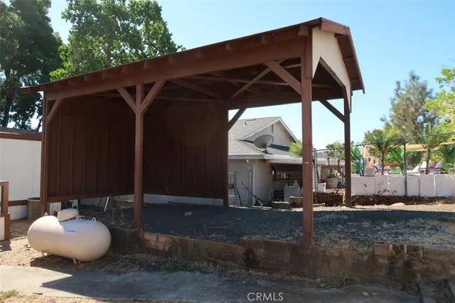 a blue and white umbrella sitting in front of a house