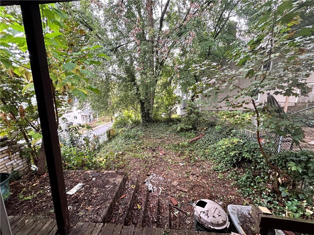 208 Delp Street Pittsburgh, PA 15202 - Photo 11 of 30 a view of a yard with plants and large trees