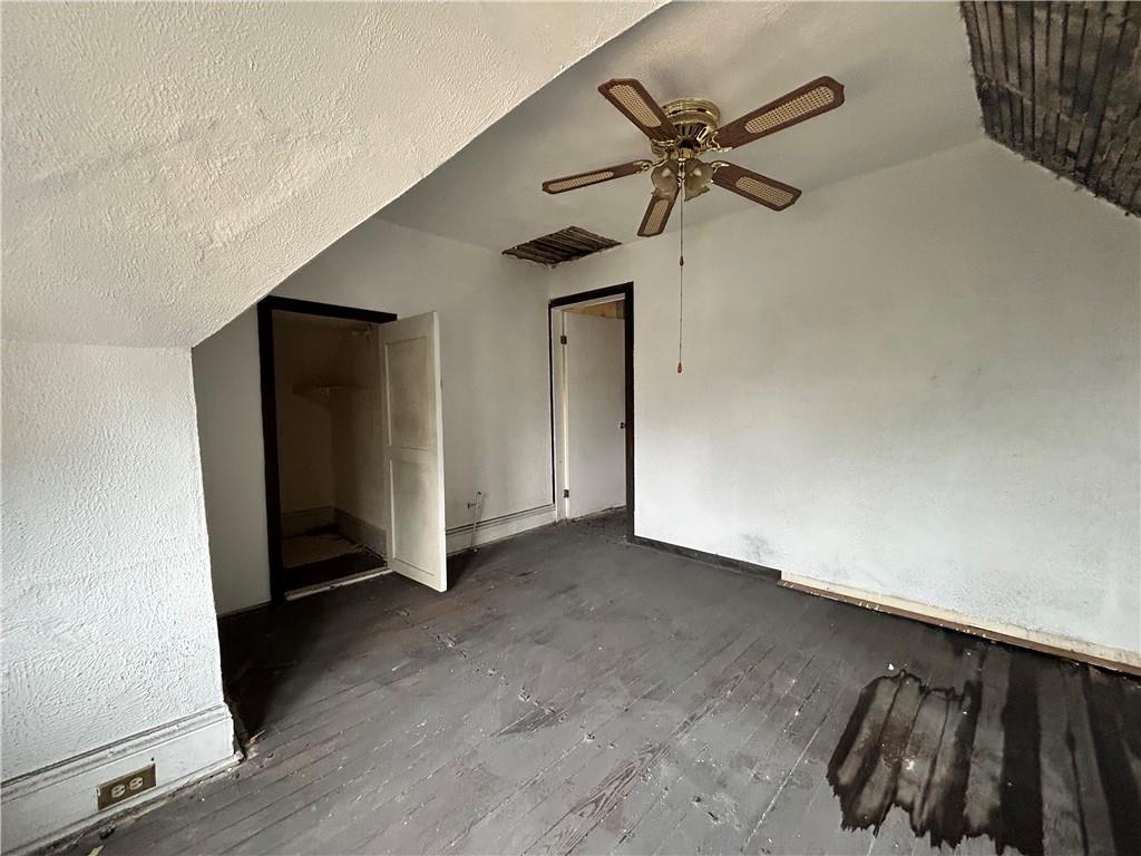 208 Delp Street Pittsburgh, PA 15202 - Photo 24 of 30 a view of a livingroom with a ceiling fan and wooden floor