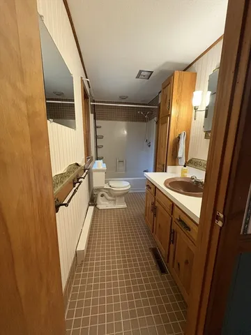 a bathroom with a sink a mirror and a shower