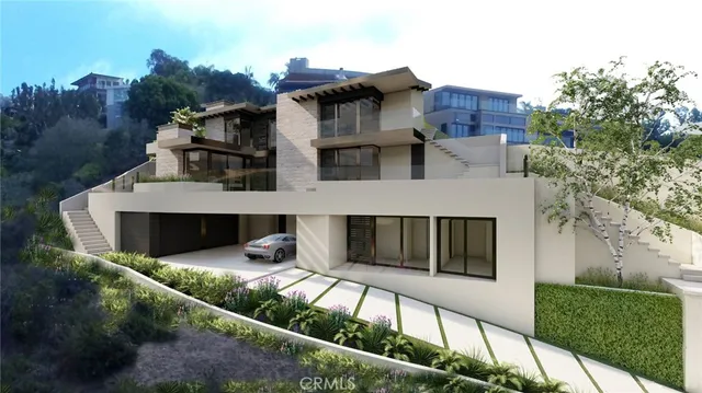 an aerial view of house with yard and mountain view in back