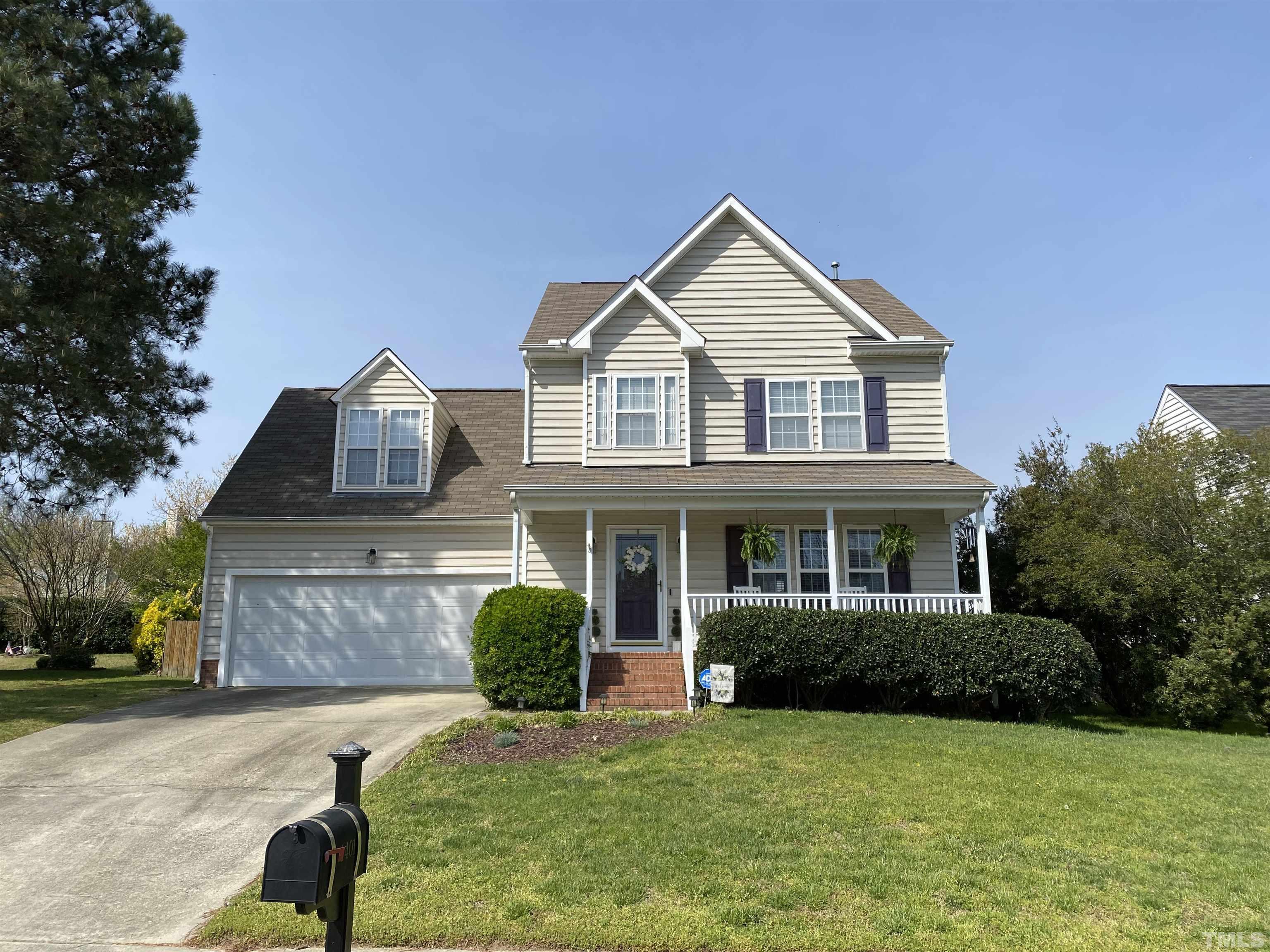 4401 Major Loring Way Raleigh, NC 27616 - Photo 1 of 20 a front view of a house with a yard and garage