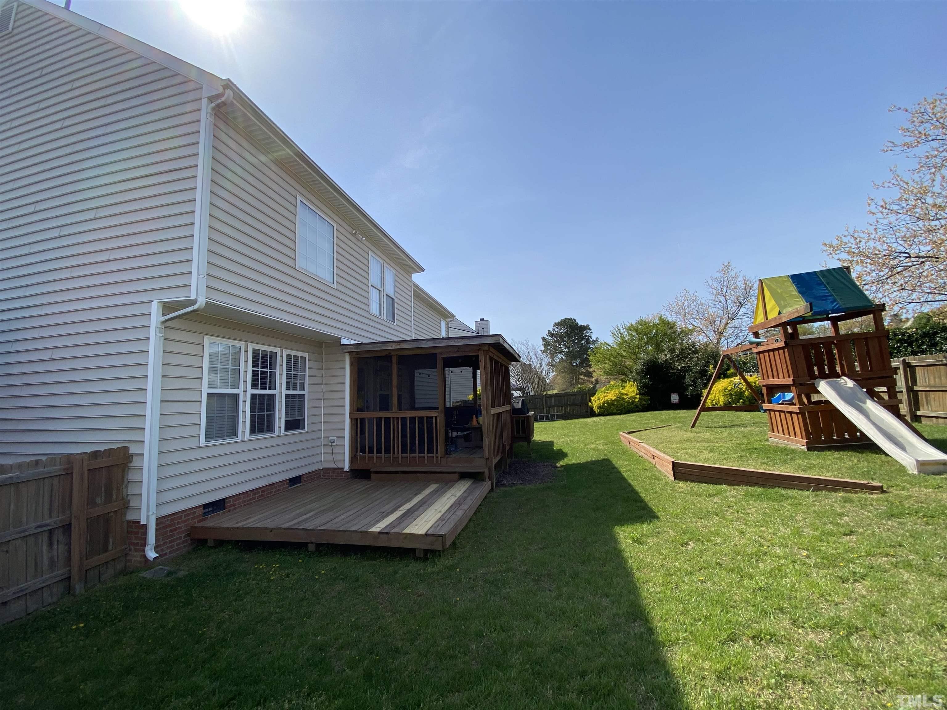 4401 Major Loring Way Raleigh, NC 27616 - Photo 2 of 20 a view of a house with a backyard and a patio