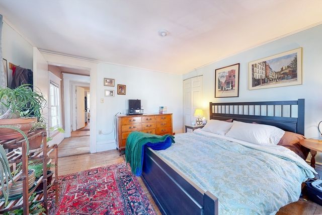 a room with a bed and furniture