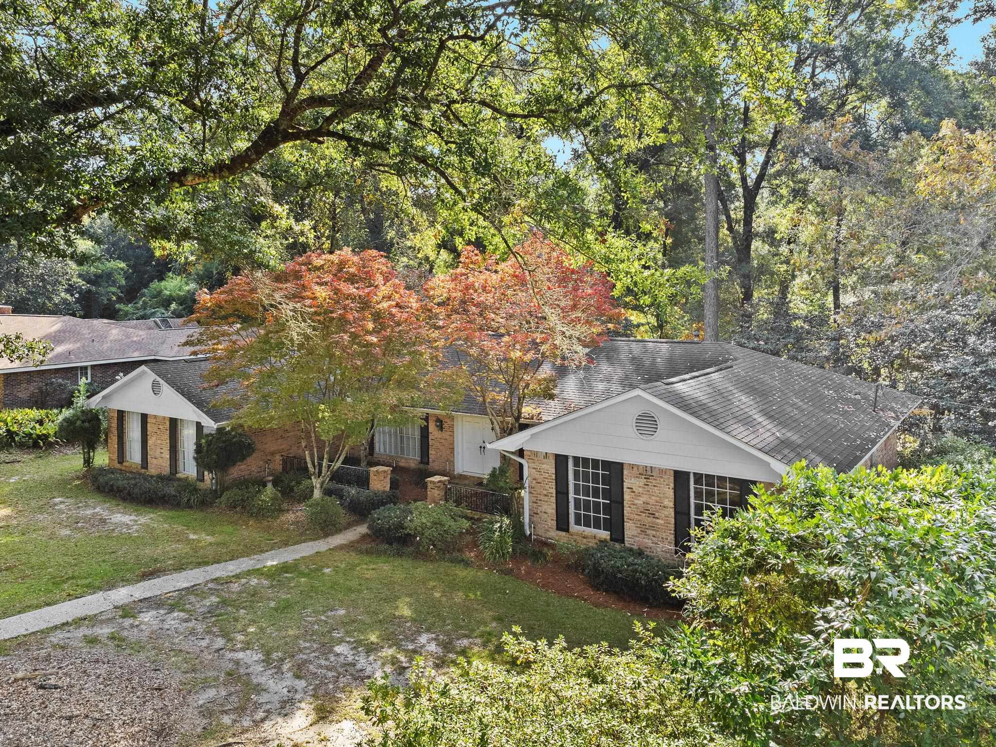 752 Evergreen Street Fairhope, AL 36532 - Photo 89 of 100 View of front of house featuring brick siding and a front yard