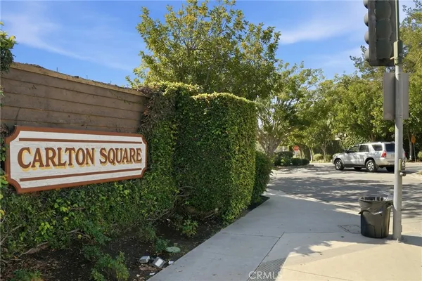 a view of a street with benches