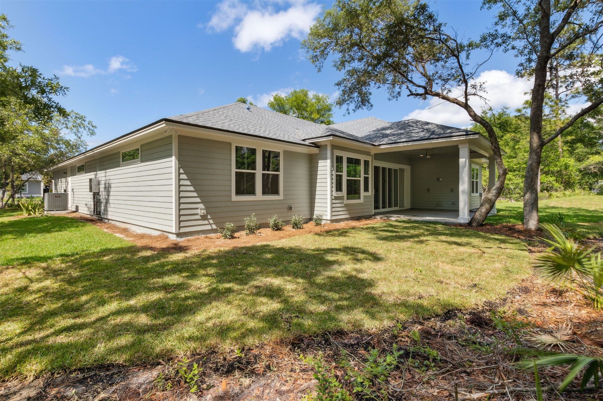 96050 Captains Pointe Road Yulee, FL 32097 - Photo 33 of 36 a front view of a house with yard