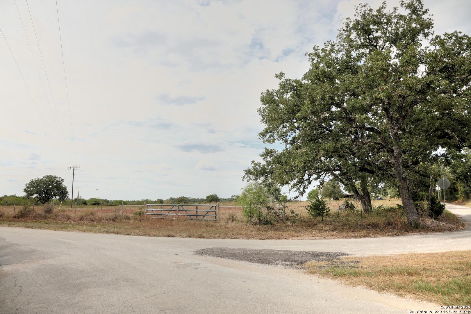 81 Sandy Creek Road Dale, TX 78616 - Photo 15 of 22 a view of a road with an ocean view