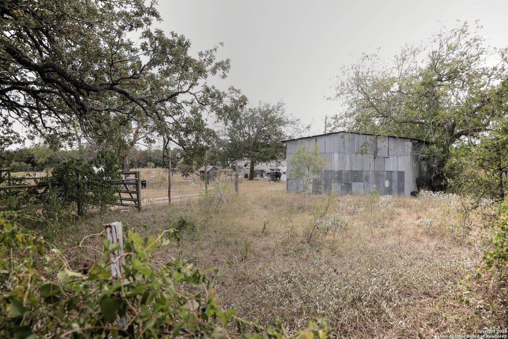 81 Sandy Creek Road Dale, TX 78616 - Photo 2 of 22 a backyard of a house with lots of green space