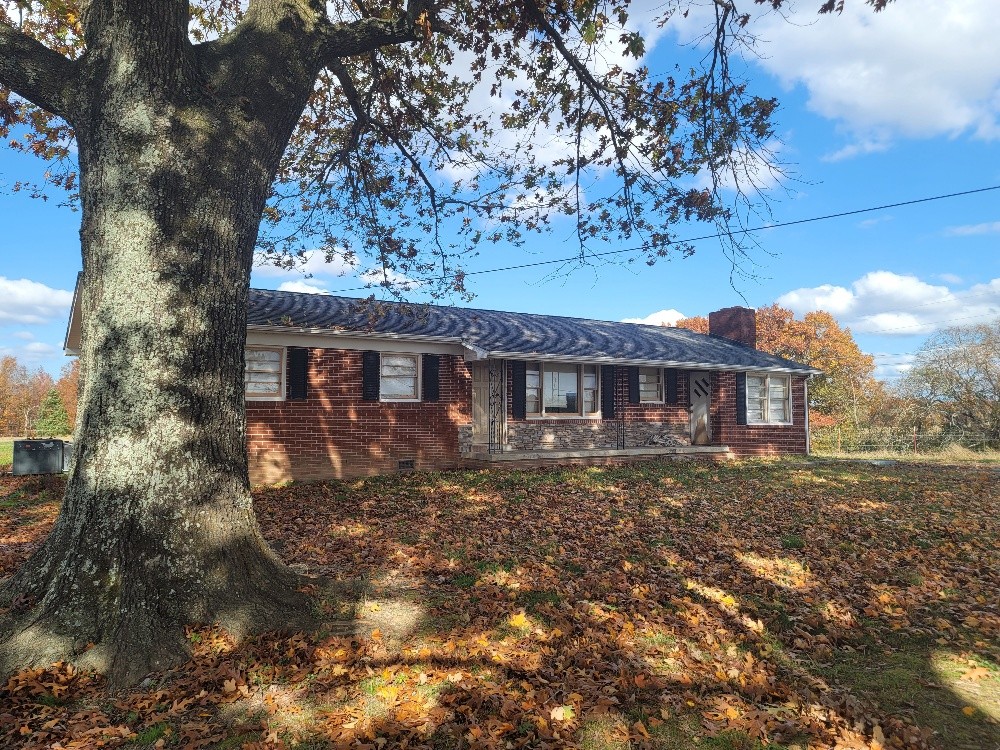 351 Powell Chapel Road Pulaski, TN 38478 - Photo 2 of 12 a front view of a house with a yard