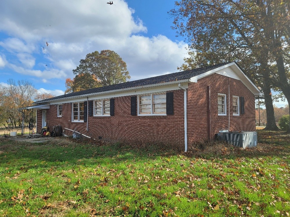 351 Powell Chapel Road Pulaski, TN 38478 - Photo 3 of 12 a front view of a house with a garden