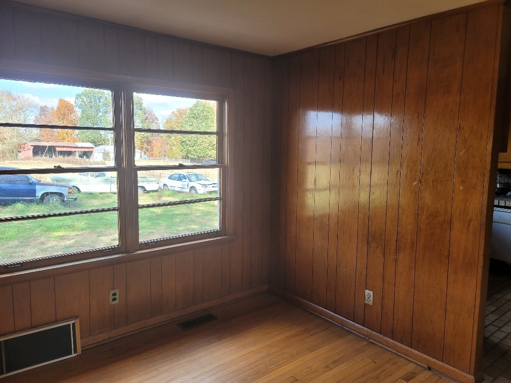 351 Powell Chapel Road Pulaski, TN 38478 - Photo 6 of 12 an empty room with wooden floor and windows