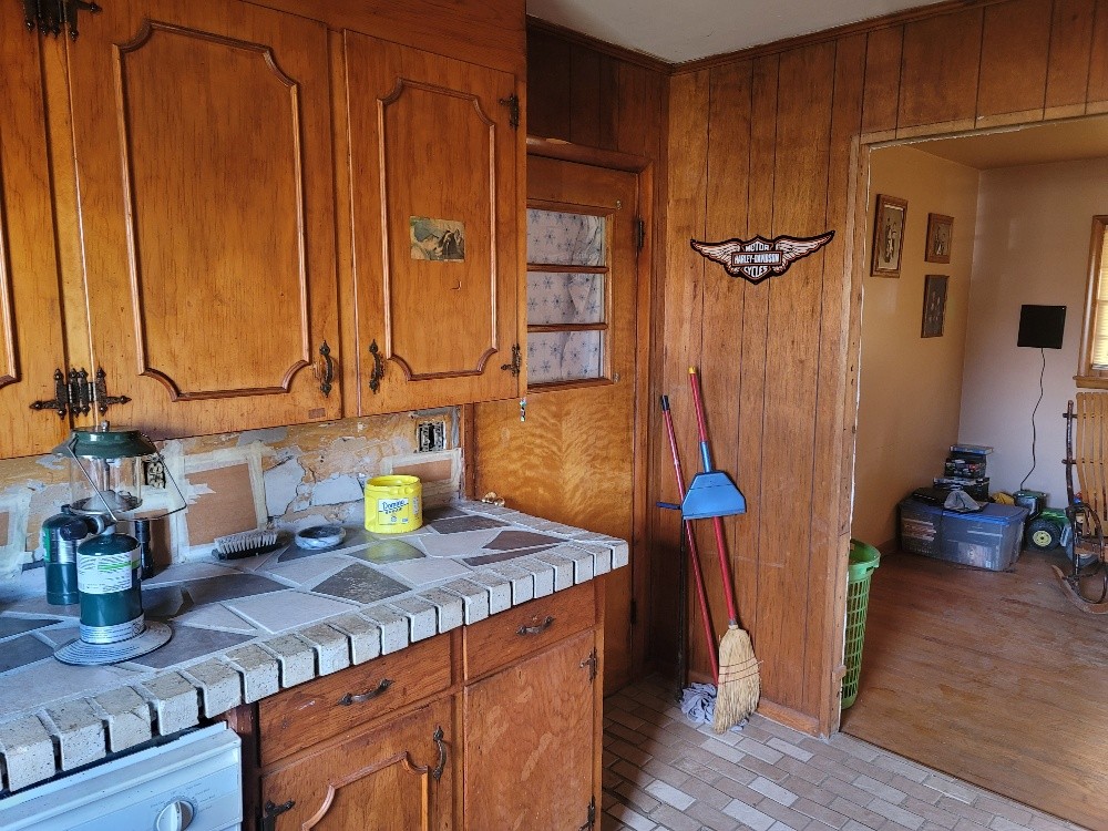 351 Powell Chapel Road Pulaski, TN 38478 - Photo 7 of 12 a kitchen with stainless steel appliances granite countertop a refrigerator and a sink