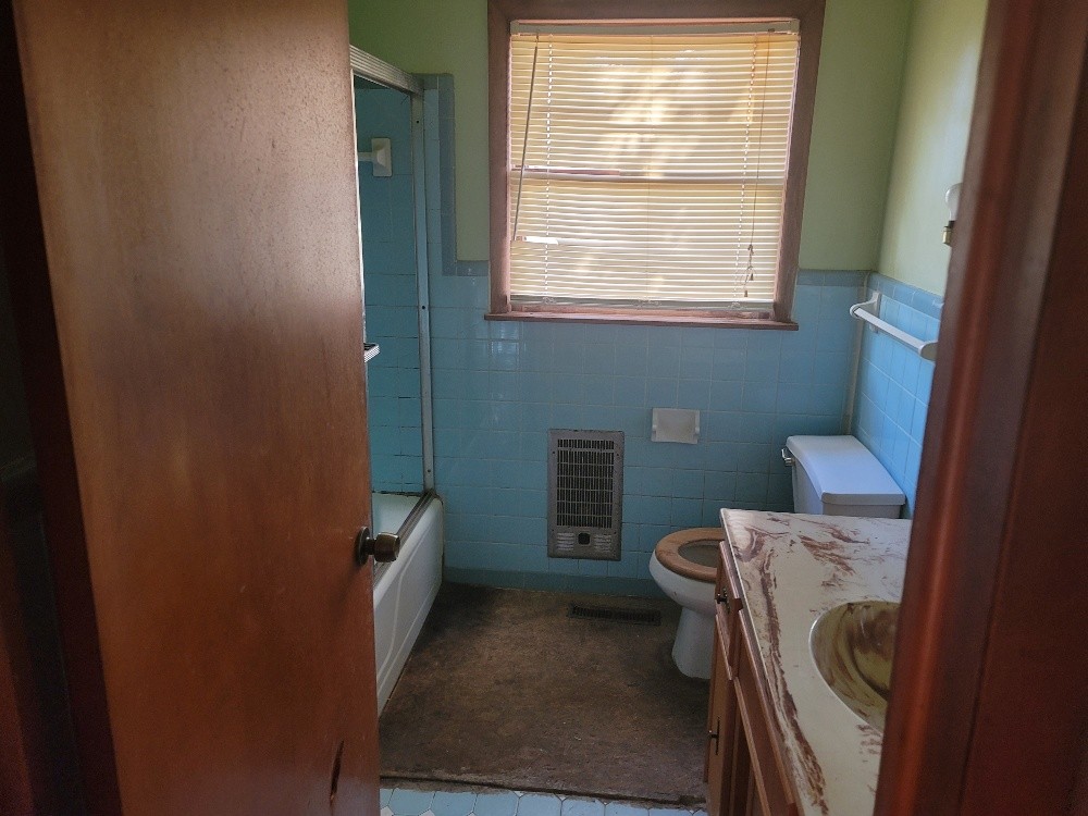 351 Powell Chapel Road Pulaski, TN 38478 - Photo 10 of 12 a bathroom with a toilet and a window