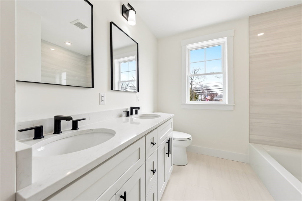 2 Old County Road, Unit 12 Salisbury, MA 01952 - Photo 10 of 29 a bathroom with a sink a toilet and shower