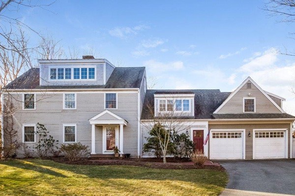 5 Linden Road Sandwich, MA 02537 - Photo 1 of 30 a front view of a house with a large window and a yard in front of it