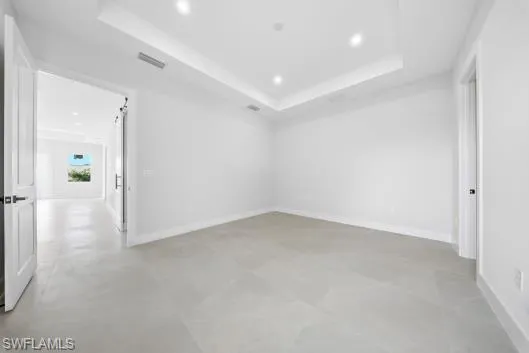 a living room with furniture and a lamp