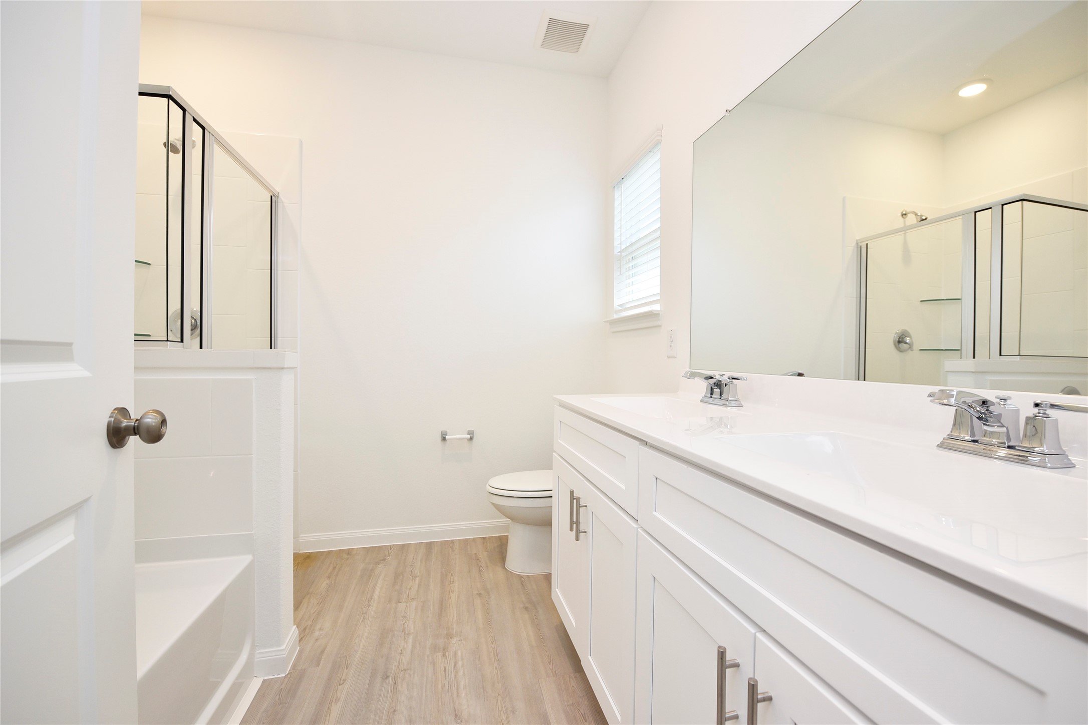 25473 Cilantro Drive Magnolia, TX 77355 - Photo 16 of 21 The primary bathroom features double sinks, a relaxing soaking tub, and a separate shower—perfect for both convenience and comfort.