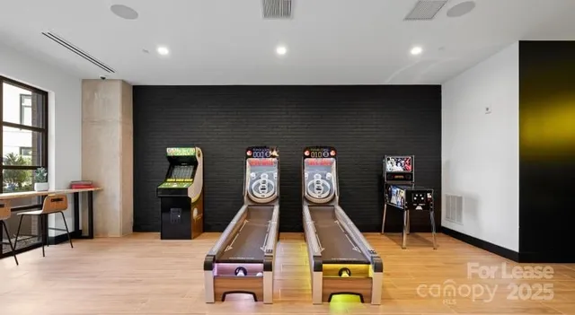 a room with wooden floor and furniture