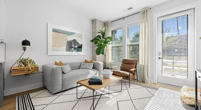 a living room with furniture and a window