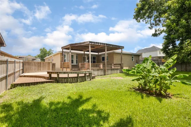 a view of a house with a yard patio and sitting area