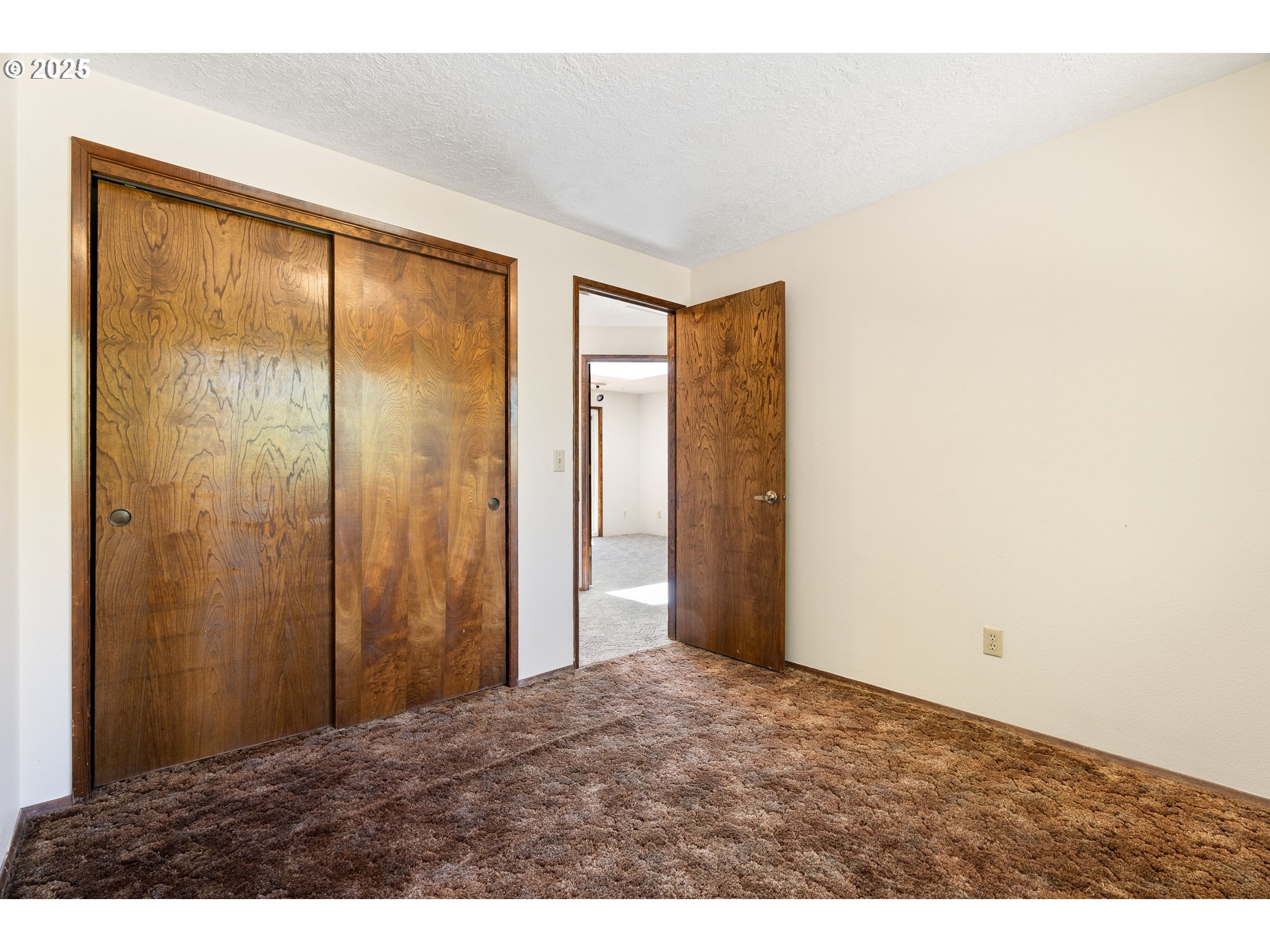 1246 Southeast Barnes Road Gresham, OR 97080 - Photo 21 of 43 a view of an empty room with closet and a window