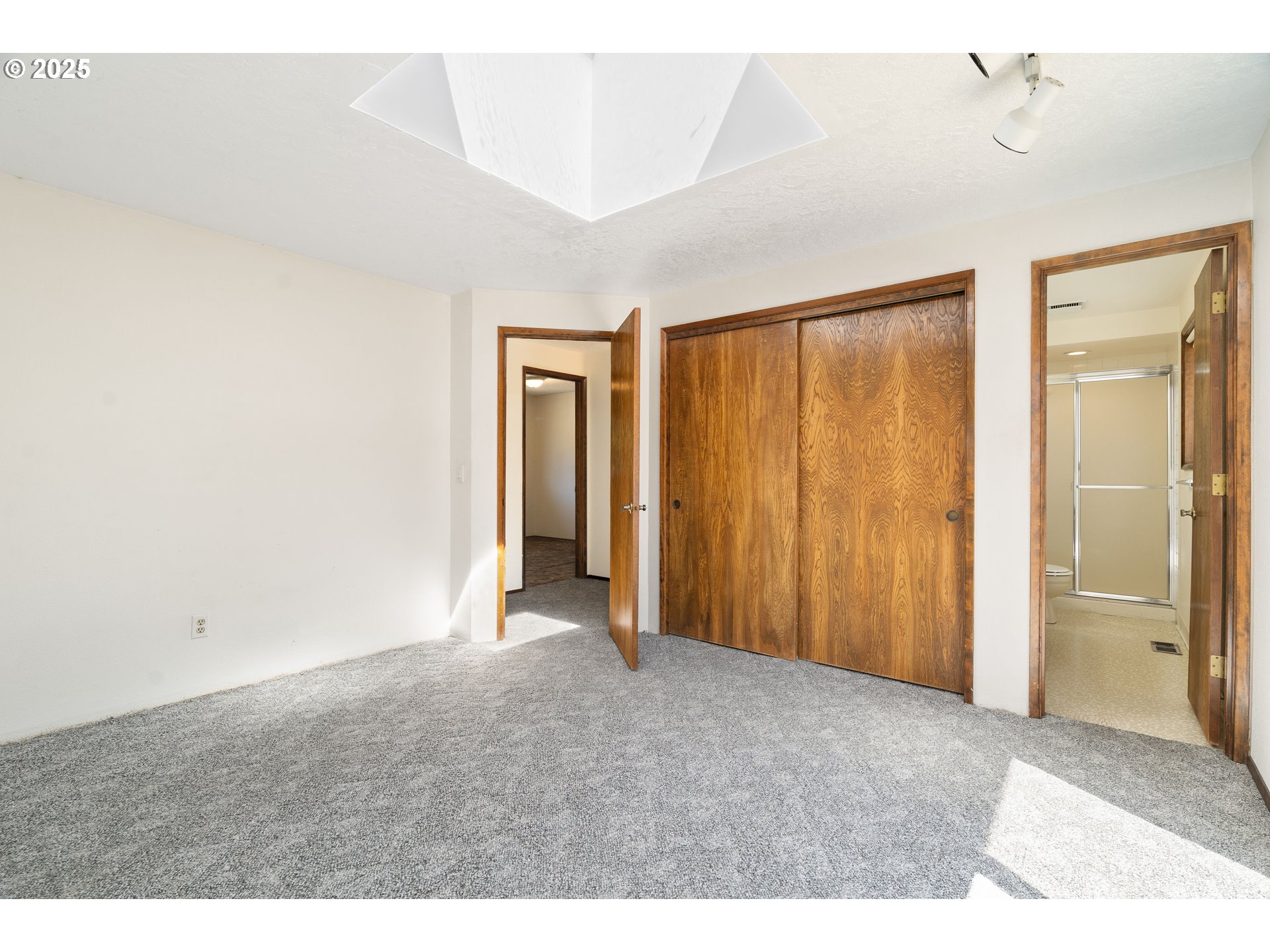 1246 Southeast Barnes Road Gresham, OR 97080 - Photo 23 of 43 a view of an empty room with a window