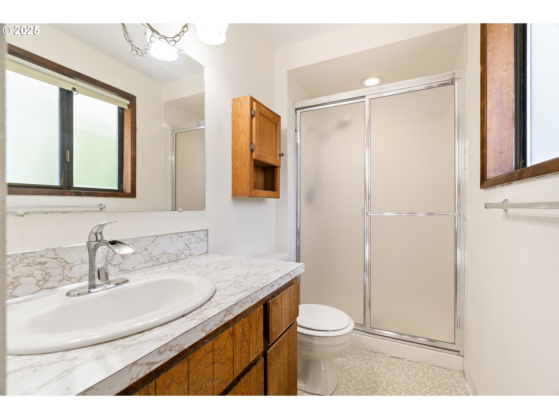 1246 Southeast Barnes Road Gresham, OR 97080 - Photo 24 of 43 a bathroom with a sink toilet a mirror and shower