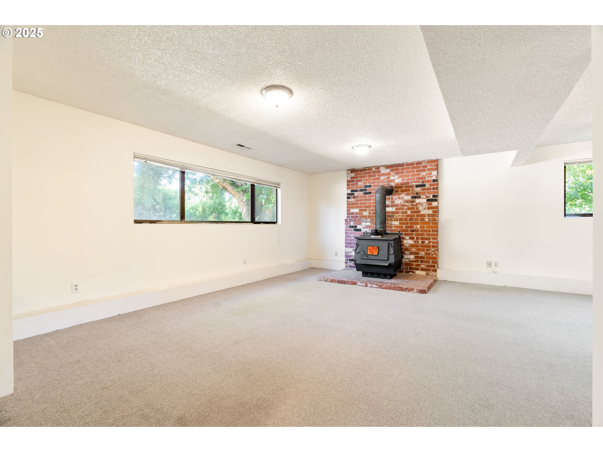 1246 Southeast Barnes Road Gresham, OR 97080 - Photo 30 of 43 a view of an empty room with a window
