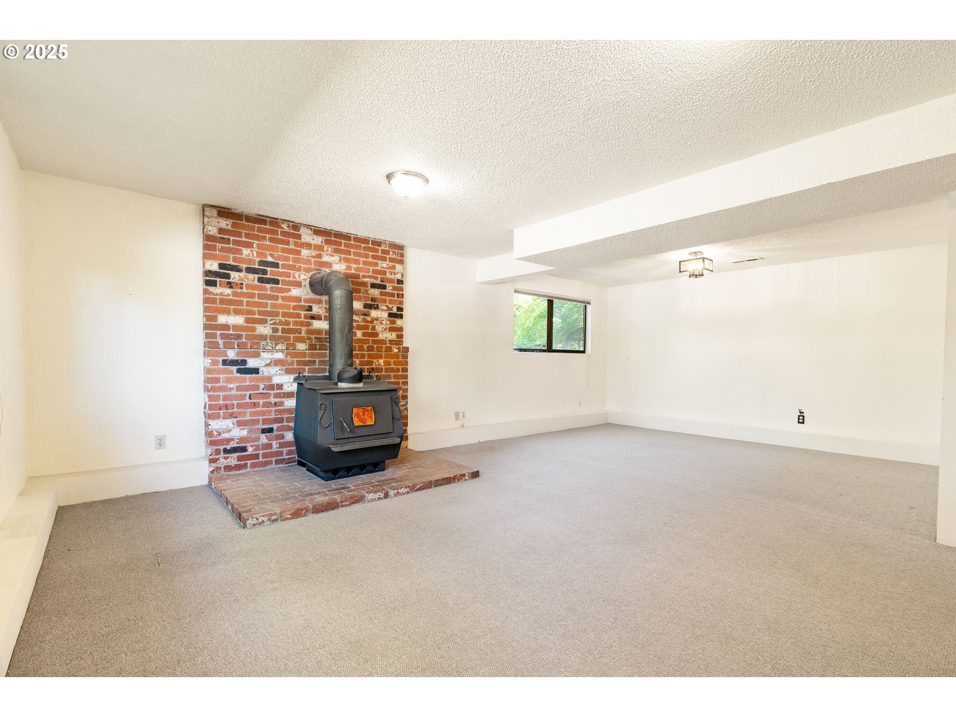 1246 Southeast Barnes Road Gresham, OR 97080 - Photo 31 of 43 a view of an empty room with a window