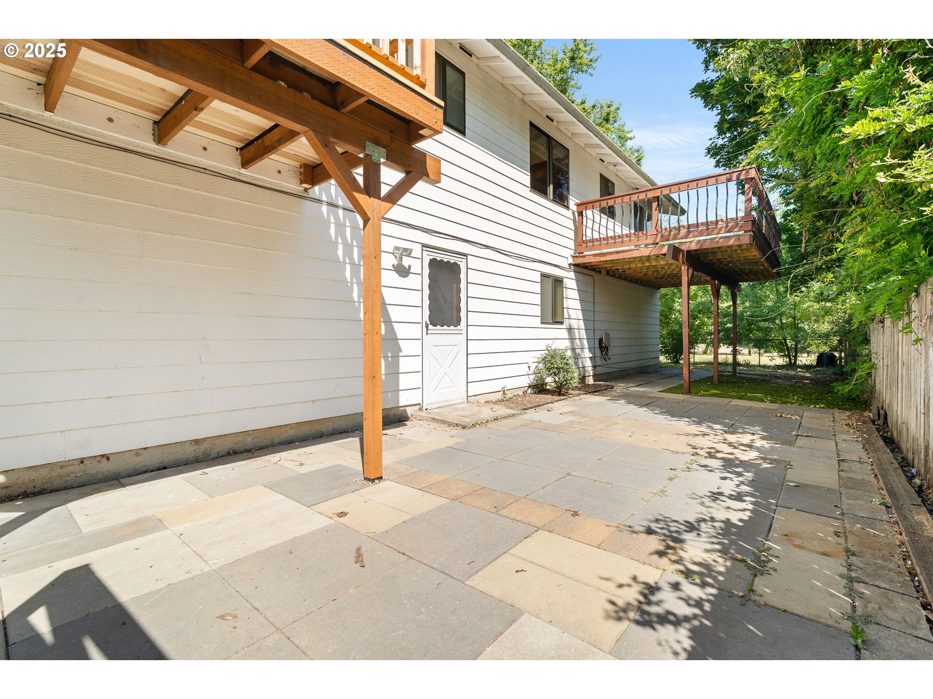 1246 Southeast Barnes Road Gresham, OR 97080 - Photo 38 of 43 a view of a white house with a outdoor space