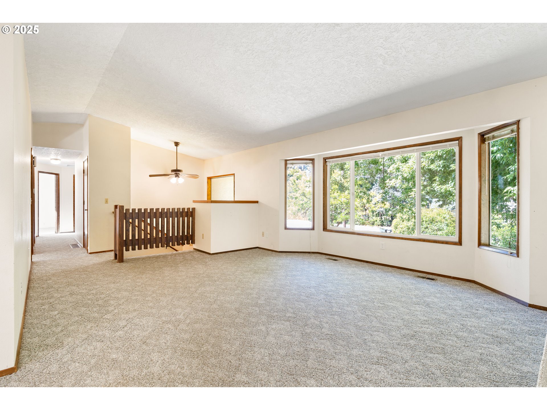 1246 Southeast Barnes Road Gresham, OR 97080 - Photo 6 of 43 a view of a livingroom with a staircase
