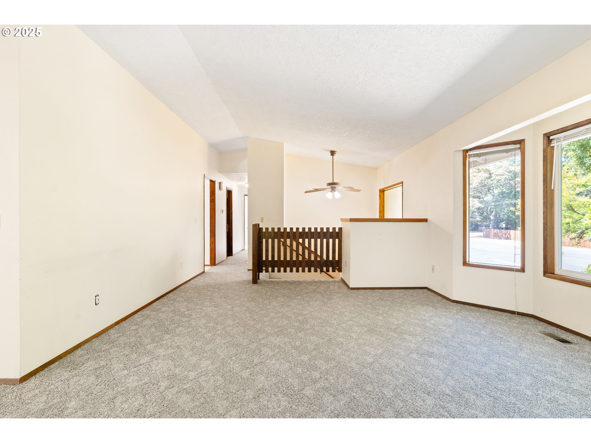 1246 Southeast Barnes Road Gresham, OR 97080 - Photo 7 of 43 a view of an empty room with a window