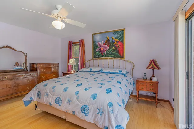 a bedroom with a bed and dresser