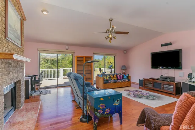 a view of a livingroom with furniture window and wooden floor