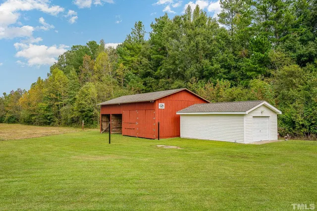 a view of a backyard of the house