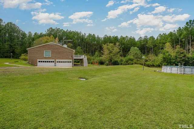 a view of a house with a big yard
