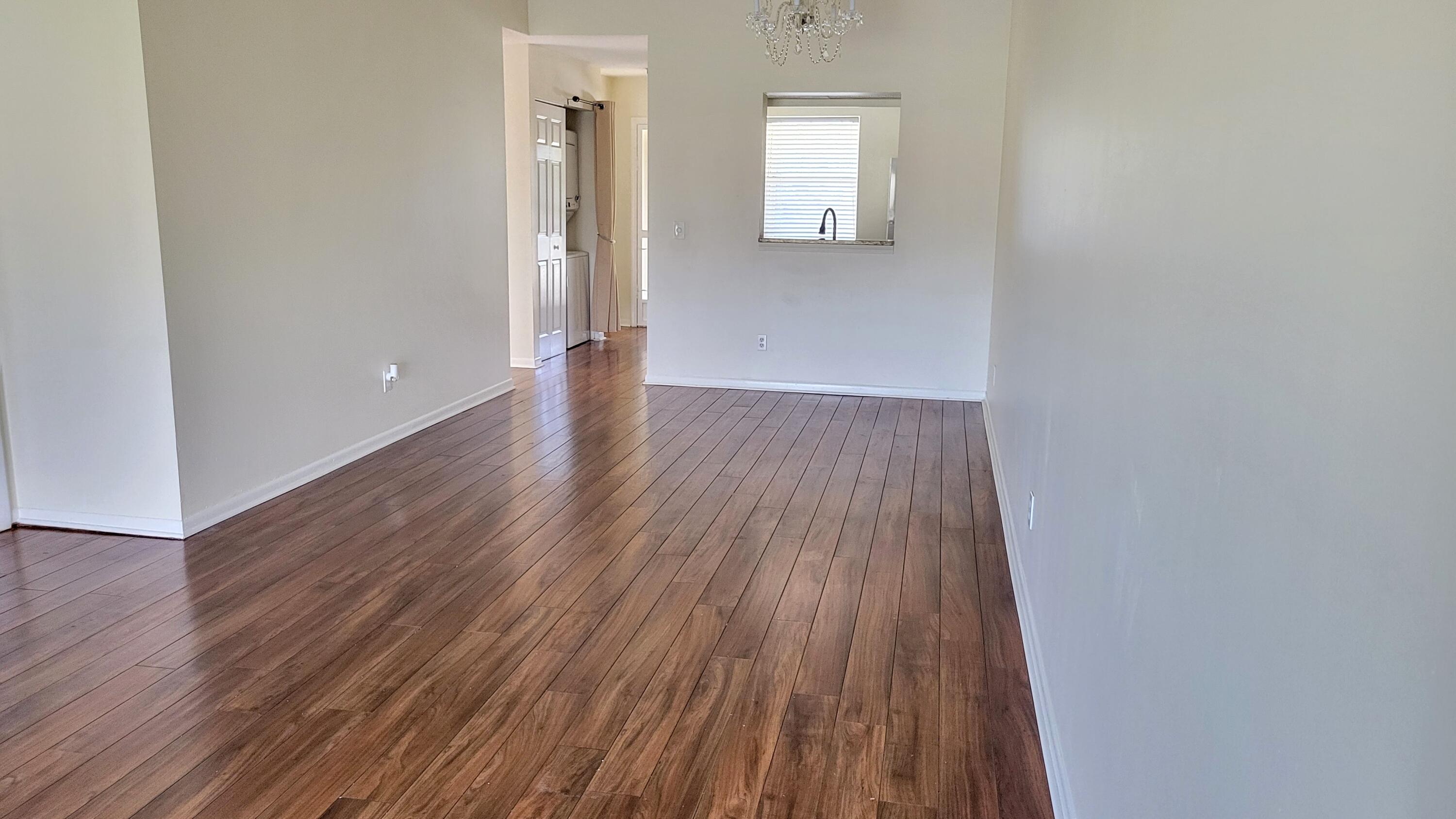 3105 Southeast Aster Lane, Unit 1806 Stuart, FL 34994 - Photo 15 of 45 a view of wooden floor and windows in a room