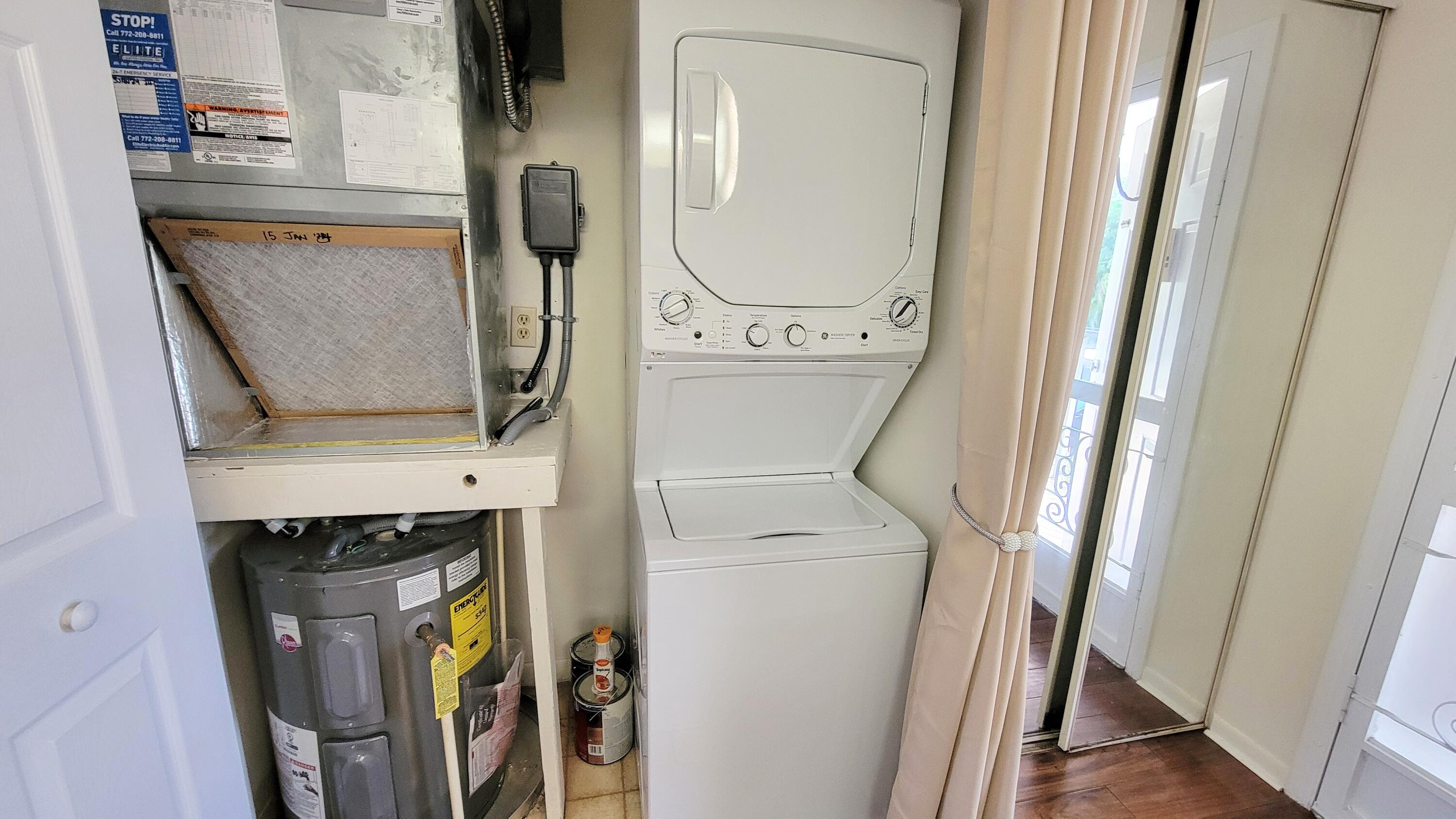 3105 Southeast Aster Lane, Unit 1806 Stuart, FL 34994 - Photo 25 of 45 a utility room with dryer and washer