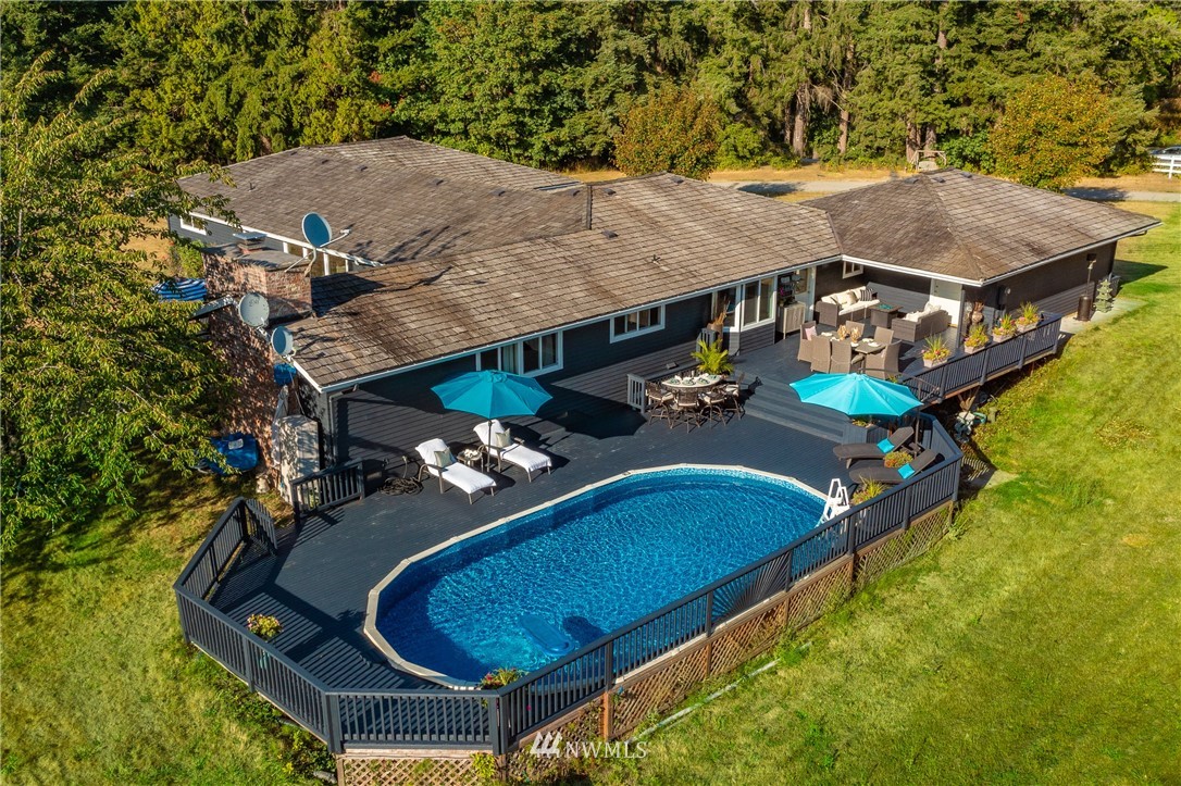 8403 Kickerville Road Blaine, WA 98230 - Photo 2 of 40 an aerial view of a house swimming pool patio and outdoor seating