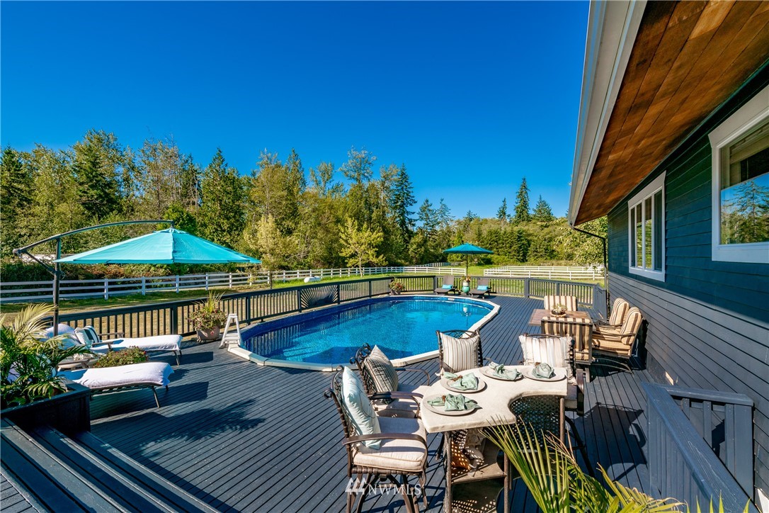 8403 Kickerville Road Blaine, WA 98230 - Photo 3 of 40 a view of swimming pool with outdoor seating