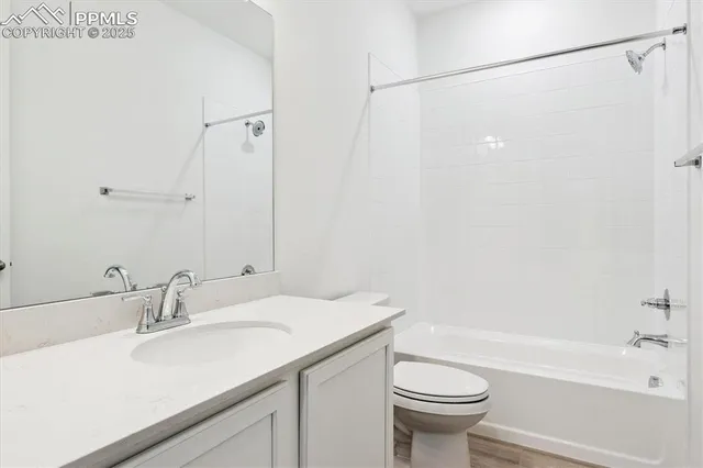 a bathroom with a sink a toilet and a bathtub